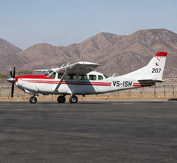 Small aircraft parked near desert mountains