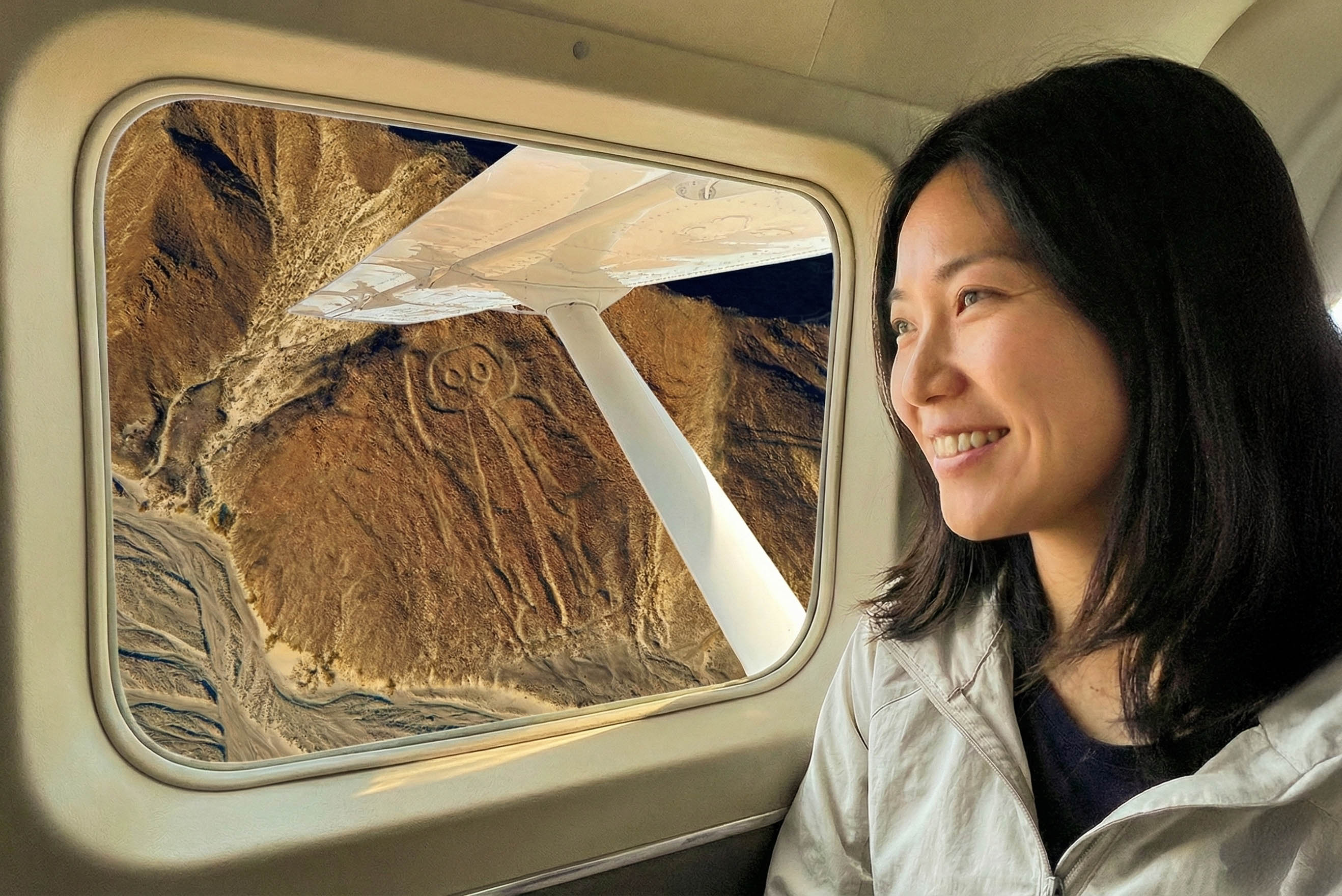 Traveler looking across the Nazca desert landscape